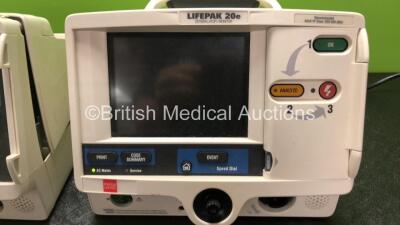 2 x Lifepak 20e Defibrillators Including ECG and Printer Options (1 x Draws Power Does Not Power Up, Both Missing Printer Modules, 1 x Spares and Repairs) - 2