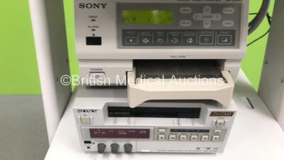 Olympus TC-C1 Clinical Trolley with Sony Trinitron PVM-14M2MDE Monitor, Olympus OTV-S6 Advanced Digital Multi Processor, Olympus CLH-250 Light Source, Sony Color Video Printer UP-21MD and Sony Digital Videocassette Recorder DSR-20MDP (All Power Up) *S/N 2 - 4