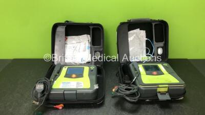 2 x Zoll AED PRO Defibrillators with 2 x 3 Lead ECG Leads, 3 x Defibrillator Pads *1 In Date, 2 Out of Date* in 2 x Carry Cases (All Power Up when Tested with Stock Battery-Batteries Not Included, 1 with Damaged Display-See Photo)