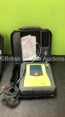 2 x Zoll AED PRO Defibrillators with 2 x 3 Lead ECG Leads, 3 x Defibrillator Pads *1 In Date, 2 Out of Date* in 2 x Carry Cases (All Power Up when Tested with Stock Battery-Batteries Not Included, 1 with Damaged Display-See Photo) - 3