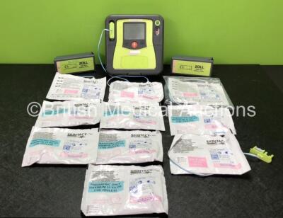 Zoll AED PRO Defibrillator with 10 x Electrode Packs *4 x in Date, 6 x Expired* and 2 x Batteries (Powers Up with Unit Failed Error, Slight Damage to Screen, 2 x Good Batteries)