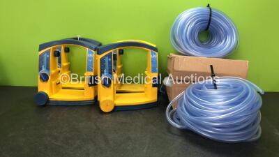 4 x Laerdal LSU Suction Units with 4 x Purple Surgical Ref ST/50/7 Coil Tubing (All Power Up with Damage and Missing Cups-See Photos)