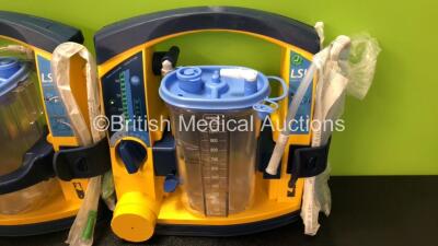 4 x Laerdal LSU Suction Units with 4 x Cups and 4 x Batteries (All Power Up, 3 x Missing Rubber Caps - See Photos) *SN 78122081687 / 78252087361 / 78081354297 / 78271469733* - 5