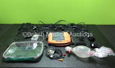 Mixed Lot Including 9 x LSU Vehicle DC Power Supplies, 1 x SpO2 FingerSim Module, 1 x Zoll 3 Lead ECG Lead, 1 x Ambu Resuscitator Balloon and Hose, 2 x AC/DC Adapters and 2 x Bags