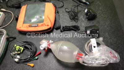 Mixed Lot Including 9 x LSU Vehicle DC Power Supplies, 1 x SpO2 FingerSim Module, 1 x Zoll 3 Lead ECG Lead, 1 x Ambu Resuscitator Balloon and Hose, 2 x AC/DC Adapters and 2 x Bags - 4