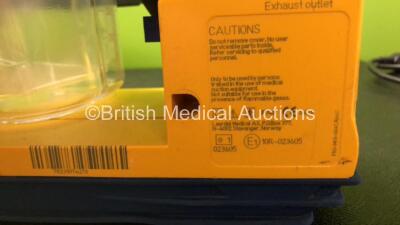 6 x Laerdal LSU Suction Units with 6 x Cups and 6 x Batteries (All Power Up, 1 x Missing Rubber Cap - See Photos) *SN 78081465016 / 78481474876 / 78041686993 / 78231074201 / 78231074213 / 78470854562* - 6