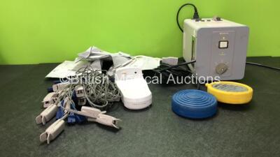 Mixed Lot Including 1 x Top Con Ref FD-12E Electronic Flash Device (Powers Up) 5 x Zoll Onestep Defibrillator Electrodes *All Out of Date* 13 x SpO2 Finger Sensors. 1 x Roch Handheld Base Unit (Missing Power Supply) 1 x Emmat Electrosurgical Footswitch *S