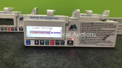 Job Lot Including 2 x McKinley T34 Syringe Pumps and 1 x CME Medical Syringe Pump (All Power Up when Tested with Stock Battery-Batteries Not Included, 2 with Missing Battery Covers-See Photo) *SN S27636, S27716, S27650* - 2