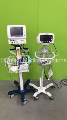 1 x Welch Allyn 53N00 Monitor on Stand with BP Hose and SPO2 Finger Sensor and 1 x Fukuda Denshi DS-7100 Patient Monitor on Stand (Both Power Up)