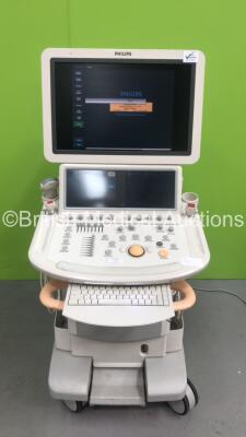 Philips iE33 Flat Screen Ultrasound Scanner Software Version 5.2.2.44 with 4 x Transducers / Probes (1 x C5-1,1 x S5-1,1 x S8-3 and 1 x L9-3) and 1 x 3-Lead ECG Lead on F Cart (Powers Up- Crack to Keyboard and Marks to Side Trim - See Photos) * SN 039VVJ