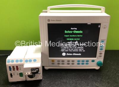 GE Datex Ohmeda Type F-CM1-05 Patient Monitor with 1 x GE E-PRESTN-00 Gas Module Including ECG, NIBP, SpO2, T1,T2, P1 and P2 Options and 1 x GE E-CAiOV-00 Including Spirometry Option and D-Fend Water Trap (Powers Up with Slight Damage to Screen - See Phot