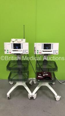 2 x Huntleigh SonicAid FM800 Encore Fetal Monitors on Stands with 1 x SonicAid Freedom Wireless Transducer System with 2 x Wireless Transducers (Both Power Up) * SN 751DX0501390-13 / 751DX0501681-13 *