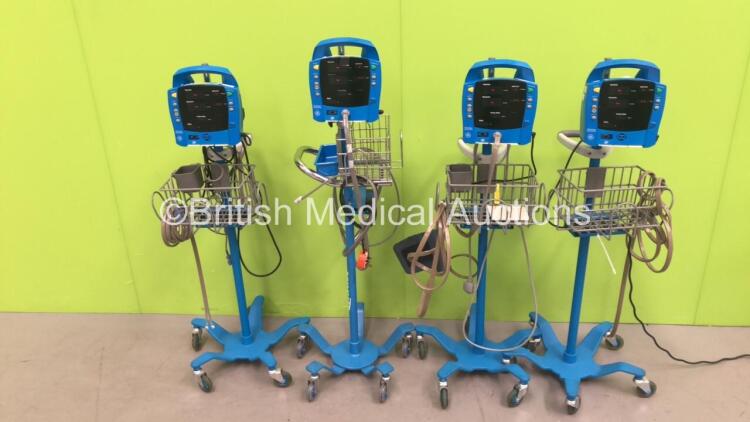 4 x GE Dinamap Procare Auscultatory Vital Signs Monitors on Stands with BP Hoses (All Powers Up) *S/N AAW07450589SA / AAW07450685SA / AAW07460172SA / AAW07460059SA*