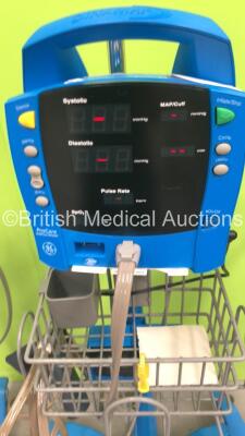 4 x GE Dinamap Procare Auscultatory Vital Signs Monitors on Stands with BP Hoses (All Powers Up) *S/N AAW07450589SA / AAW07450685SA / AAW07460172SA / AAW07460059SA* - 4