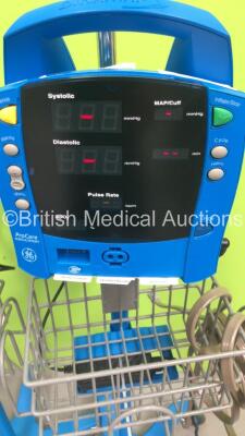 4 x GE Dinamap Procare Auscultatory Vital Signs Monitors on Stands with BP Hoses (All Powers Up) *S/N AAW07450589SA / AAW07450685SA / AAW07460172SA / AAW07460059SA* - 5