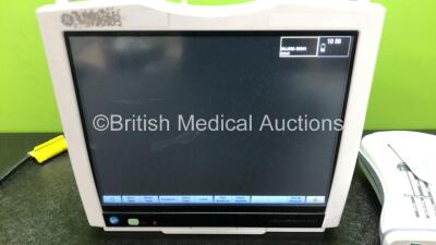 GE B450 Carescape Patient Monitor *Mfd 2015* (Powers Up with Damaged Casing, Missing Light Cover - See Photos) Including 1 x GE 2016793-002 Patient Data Module with ECG, Temp/CO, P1/P3, P2/P4, SpO2 and NIBP Options *Mfd 2013* - 2