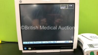 GE B450 Carescape Patient Monitor *Mfd 2015* (Powers Up with Damaged Casing, Missing Light Cover, Damaged Power Button - See Photos) Including 1 x GE 2016793-002 Patient Data Module with ECG, Temp/CO, P1/P3, P2/P4, SpO2 and NIBP Options *Mfd 2015* - 2