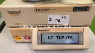 1 x Sonicaid Team Duo Fetal Monitor on Stand with 1 x Transducer and 1 x Sonicaid Team Fetal Monitor on Stand with 1 x Transducer (Both Power Up) - 2