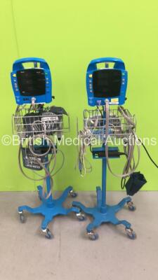 1 x GE Dinamap ProCare 300 Vital Signs Monitor on Stand with BP Hose (Missing 1 x Button) and 1 x GE Dinamap ProCare Auscultatory 300 Vital Signs Monitor on Stand with SPO2 Finger Sensor and BP Hose (1 x Powers Up) *S/N AAW05290261SA*