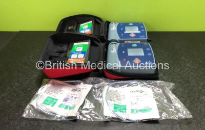 2 x Philips Heartstart FR2+ Defibrillators with 2 x Philips M3863A Batteries and 2 x Skintact Electrode Packs *Both Expired* in Carry Cases (Both Power Up and Pass Self Test) *SN 0203085685 / 0307227875*