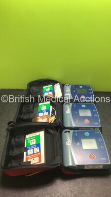 3 x Philips Heartstart FR2+ Defibrillators with 1 x Philips M3864A Battery in 3 x Carry Cases (All Power Up) *SN 0307228215, 0307227301, 0203085958*