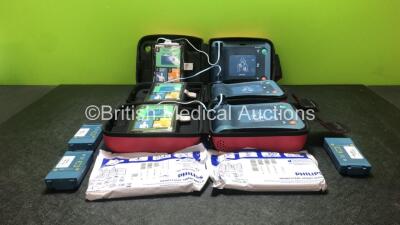 3 x Philips Heartstart FRx Defibrillators with 6 x Batteries and 5 x Philips Heartstart Smart Pads II In 3 x Carry Cases (All Powers Up) *SN B14C01152, B12L01320, B14C01151*