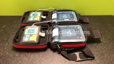 2 x Philips Heartstart FRx Defibrillators with 2 x Batteries and 2 x Philips Heartstart Smart Pads II In Carry Cases (Both Power Up)