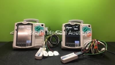 2 x Philips Heartstart MRx Defibrillators Including Pacer, ECG and Printer Options with 2 x Philips M3539A Modules, 2 x Philips M3538A Batteries, 2 x Paddle Leads, 2 x Philips M3725A 50 Ohm Test Loads and 2 x 3 Lead ECG Leads (Both Power Up) *SN US0031532