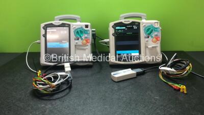 2 x Philips Heartstart MRx Defibrillators Including Pacer, ECG and Printer Options with 2 x Philips M3539A Modules, 2 x Philips M3538A Batteries, 2 x Paddle Leads, 2 x Philips M3725A 50 Ohm Test Loads and 2 x 3 Lead ECG Leads (Both Power Up) *SN US0031538