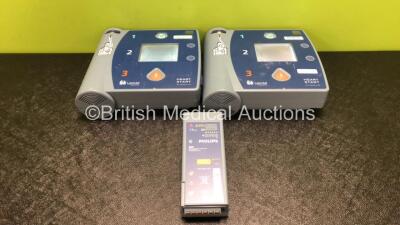 2 x Philips Heartstart FR2+ Defibrillators with 3 x Philips M3863A Batteries (Both Power Up and Pass Self Test)