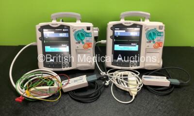 2 x Philips Heartstart MRx Defibrillators Including ECG and Printer Options with 2 x Philips M3539A Modules, 2 x Philips M3538A Batteries, 2 x Paddle Leads, 2 x Philips M3725A 50 Ohm Test Loads, 1 x 3 Lead ECG Lead and 1 x 5 Lead ECG Lead (Both Power Up) 