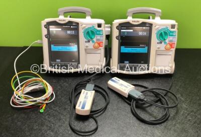 2 x Philips Heartstart MRx Defibrillators Including ECG and Printer Options with 2 x Philips M3539A Modules, 2 x Philips M3538A Batteries, 2 x Paddle Leads, 2 x Philips M3725A 50 Ohm Test Loads and 1 x 3 Lead ECG Lead (Both Power Up) *SN US00315370 / US00