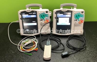 2 x Philips Heartstart MRx Defibrillators Including ECG, Pacer and Printer Options with 2 x Philips M3539A Modules, 2 x Philips M3538A Batteries, 2 x Paddle Leads, 1 x Philips M3725A 50 Ohm Test Load and 1 x 3 Lead ECG Lead (Both Power Up) *SN US00315387 