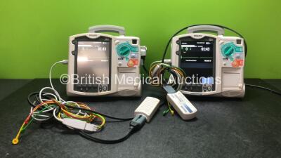 2 x Philips Heartstart MRx Defibrillators Including ECG and Printer Options with 2 x Philips M3539A Modules, 2 x Philips M3538A Batteries, 2 x Paddle Leads,1 x Philips M3725A 50 Ohm Test Load and 1 x 3 Lead ECG Lead (Both Power Up) *SN US00315373, US00554