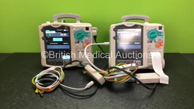 2 x Philips Heartstart MRx Defibrillators Including Pacer, ECG and Printer Options with 2 x Philips M3539A Modules, 2 x Philips M3538A Batteries, 2 x Paddle Leads, 1 x Philips M3725A 50 Ohm Test Load and 1 x 3 Lead ECG Leads (Both Power Up) *SN US00315320