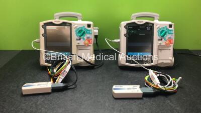 2 x Philips Heartstart MRx Defibrillators Including Pacer, ECG and Printer Options with 2 x Philips M3539A Modules, 2 x Philips M3538A Batteries, 2 x Paddle Leads, 1 x Philips M3725A 50 Ohm Test Load and 2 x 3 Lead ECG Lead (Both Power Up) *SN US00315319,