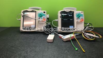 2 x Philips Heartstart MRx Defibrillators Including Pacer, ECG and Printer Options with 2 x Philips M3539A Modules, 2 x Philips M3538A Batteries, 2 x Paddle Leads, 1 x Philips M3725A 50 Ohm Test Load and 2 x 3 Lead ECG Leads (Both Power Up) *SN US00315330