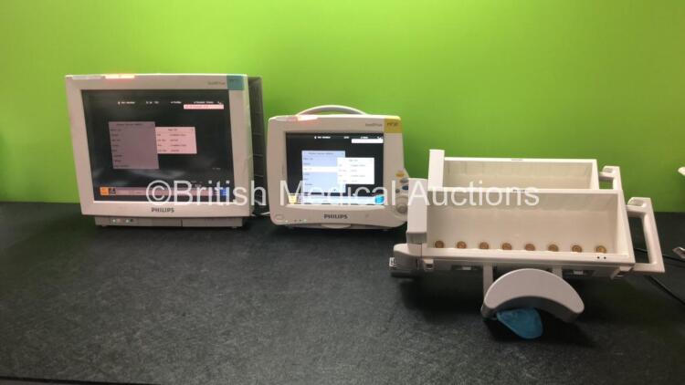 Job Lot Including 1 x Philips IntelliVue MP70 Touch Screen Patient Monitor (Powers Up) 1 x Philips IntelliVue MP20 Patient Monitor (Powers Up) and 2 x Philips M8048A Module Racks