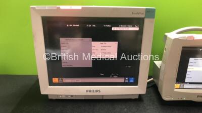 Job Lot Including 1 x Philips IntelliVue MP70 Touch Screen Patient Monitor (Powers Up) 1 x Philips IntelliVue MP20 Patient Monitor (Powers Up) and 2 x Philips M8048A Module Racks - 2