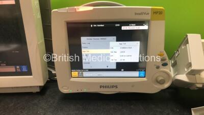 Job Lot Including 1 x Philips IntelliVue MP70 Touch Screen Patient Monitor (Powers Up) 1 x Philips IntelliVue MP20 Patient Monitor (Powers Up) and 2 x Philips M8048A Module Racks - 3