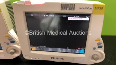 2 x Philips IntelliVue MP30 Patient Monitors (Both Power Up with Slight Damage to Screens and Damage to Casing - See Photos) with 2 x Philips M3001A Modules Including Press, Temp, NBP, SpO2 and ECG/Resp Options - 4