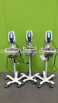 3 x Welch Allyn Spot Vital Signs Monitors with 3 x AC Power Supplies on Stands (All Power Up)