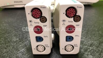 2 x Philips IntelliVue MP50 Patient Monitors (Both Power Up, 1 x Missing Dial and 1 x Damage to Casing and Damaged / Missing Dial - See Photos) with 2 x Philips M3001A Modules Including Press, Temp, NBP, SpO2 and ECG/Resp Options - 6