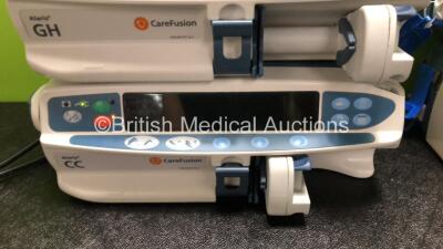 Job Lot Including 6 x CareFusion Alaris GH Syringe Pumps (All Power Up, 1 x SP1 Code, 1 x AD1 Code) 2 x Cardinal Health Alaris GH Syringe Pumps (Both Power Up) and 1 x CareFusion Alaris CC Syringe Pump (Draws Power Does Not Power Up) - 4