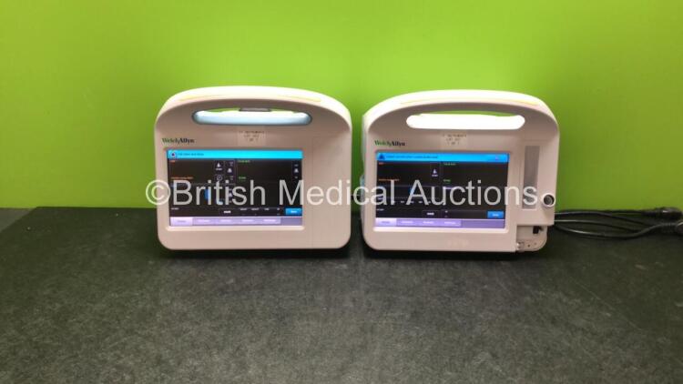 2 x Welch Allyn 6000 Series Vital Signs Monitors Including SpO2 and NIBP Options (Both Power Up, 1 with Missing Cover and Handle Cover-See Photos)