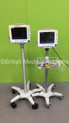 2 x Datex-Ohmeda S5 Patient Monitors on Stands with 1 x GE E-PSM-00 Multi Parameter Module with NBP / T1-2 / SPO2 and ECG Options and 1 x GE E-PSMP-00 Multiparameter Module with NIBP / P1-P2 /T1-2 / SPO2 and ECG Options (Both Power Up) *S/N 6763391 / 6463