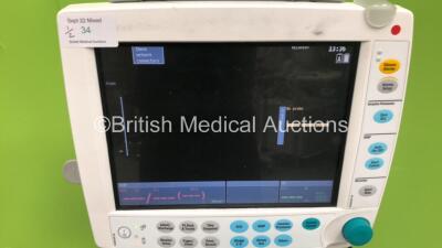 2 x Datex-Ohmeda S5 Patient Monitors on Stands with 1 x GE E-PSM-00 Multi Parameter Module with NBP / T1-2 / SPO2 and ECG Options and 1 x GE E-PSMP-00 Multiparameter Module with NIBP / P1-P2 /T1-2 / SPO2 and ECG Options (Both Power Up) *S/N 6763391 / 6463 - 2