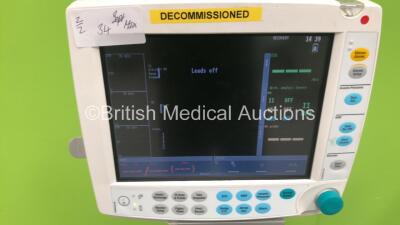 2 x Datex-Ohmeda S5 Patient Monitors on Stands with 1 x GE E-PSM-00 Multi Parameter Module with NBP / T1-2 / SPO2 and ECG Options and 1 x GE E-PSMP-00 Multiparameter Module with NIBP / P1-P2 /T1-2 / SPO2 and ECG Options (Both Power Up) *S/N 6763391 / 6463 - 5