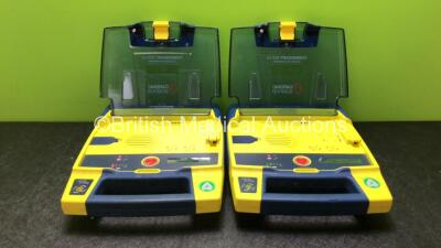 2 x Cardiac Science Powerheart AED G3 Defibrillators with 2 x Powerheart AED G3 Batteries (Both Power Up)