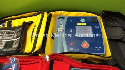 4 x Laerdal Heartstart FR2+ Defibrillators with 4 x Batteries, 4 x Skintact Electrodes, 1 x 3 Lead ECG Lead in Carry Bags (All Power Up and Pass Self Test) *SN 0307227346,0207226014,0207224363,1207266814* - 3